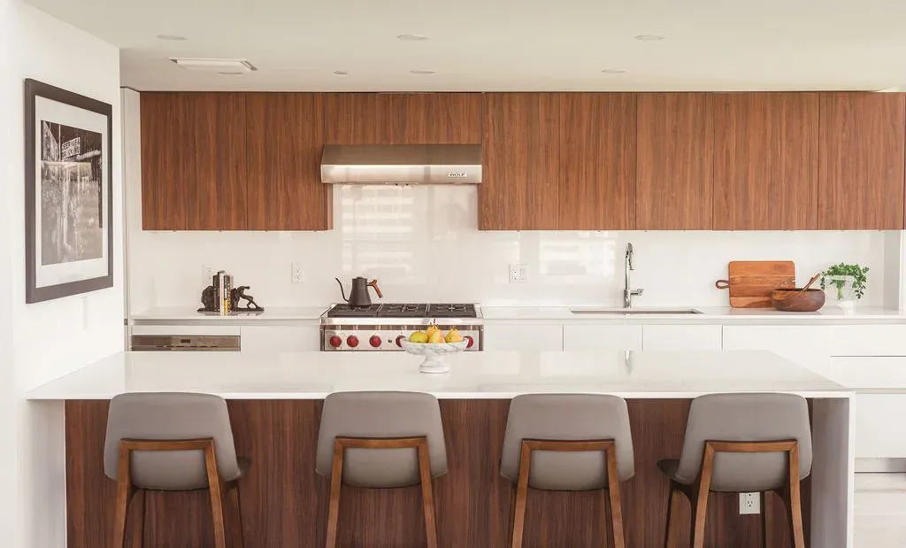 Blue-lacquered millwork kitchen bar at Flamingo Point residence, Miami Beach