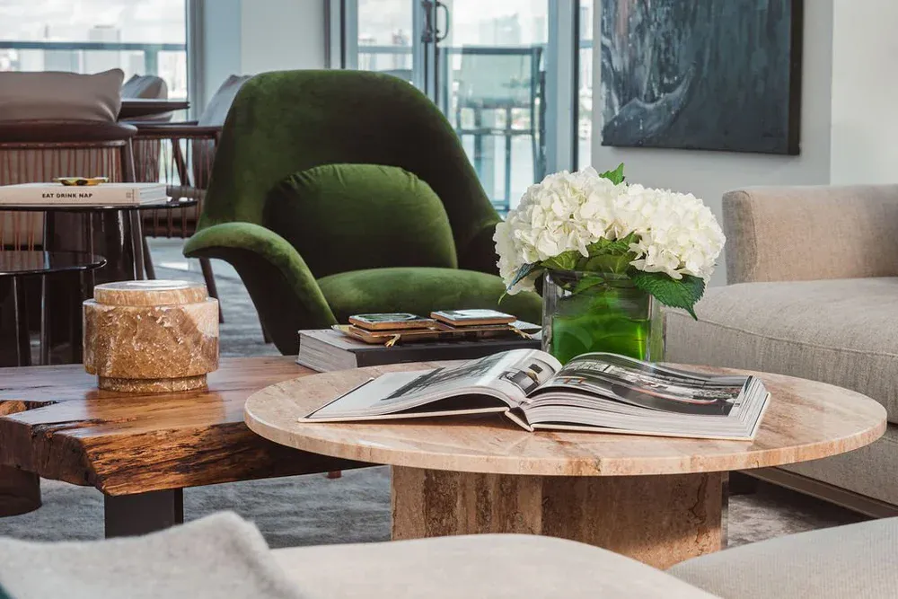 Green velvet swivel chair with bay views at Flamingo Point residence, Miami Beach