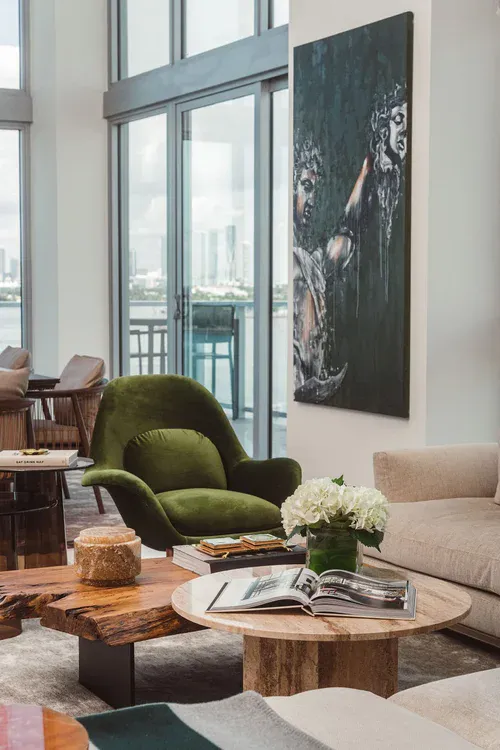 Layered textile detail and sculptural lounge chair at Flamingo Point penthouse, Miami Beach