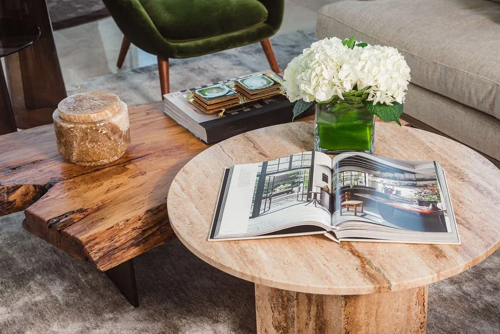 Live-edge coffee table and olive velvet seating in Flamingo Point penthouse living room, Miami Beach