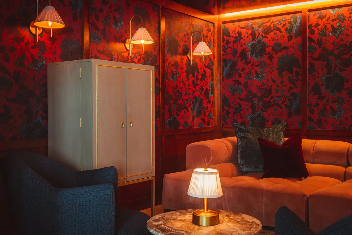 Crimson botanical wallpapered speakeasy library at Flamingo Point penthouse, Miami Beach