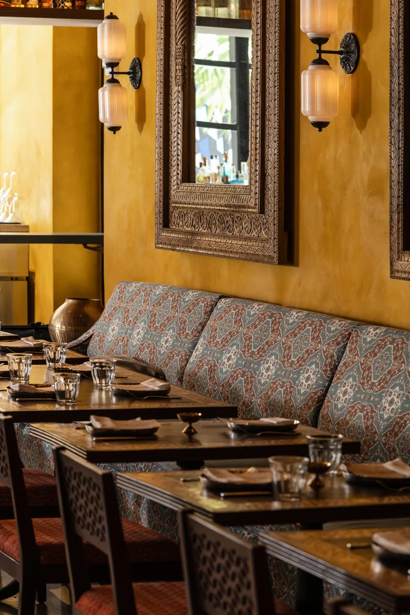 Hand-carved wooden chair imported from India at Ghee Indian Kitchen, Wynwood Miami