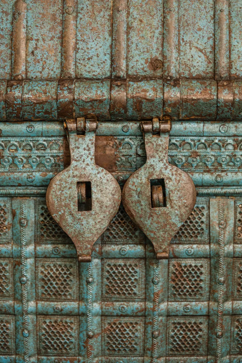 Hand-carved wood screen and textile wall hangings at Ghee Indian Kitchen, Wynwood Miami