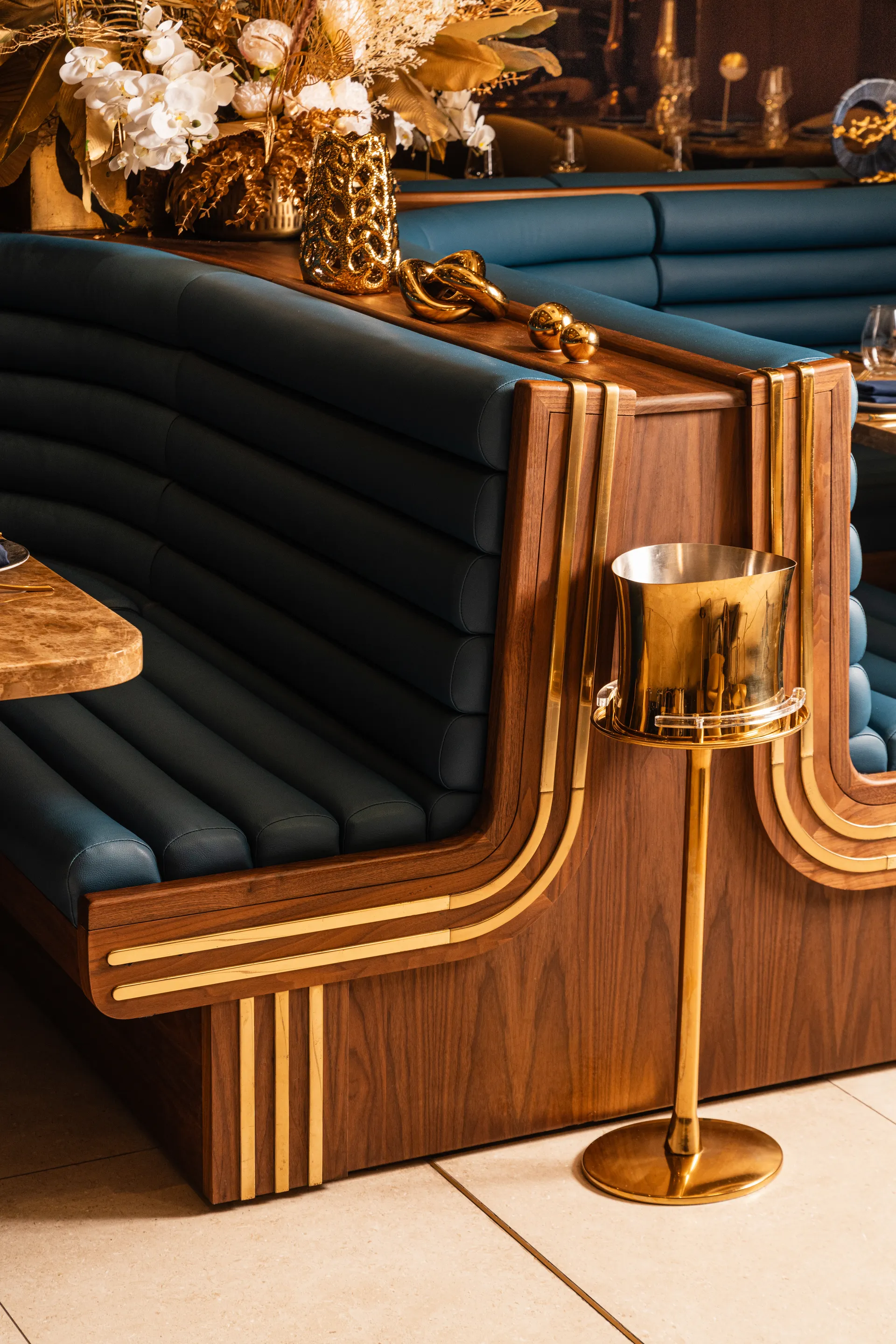 Elixir lounge with purple upholstery and custom millwork, lower level of Oro restaurant Miami Beach