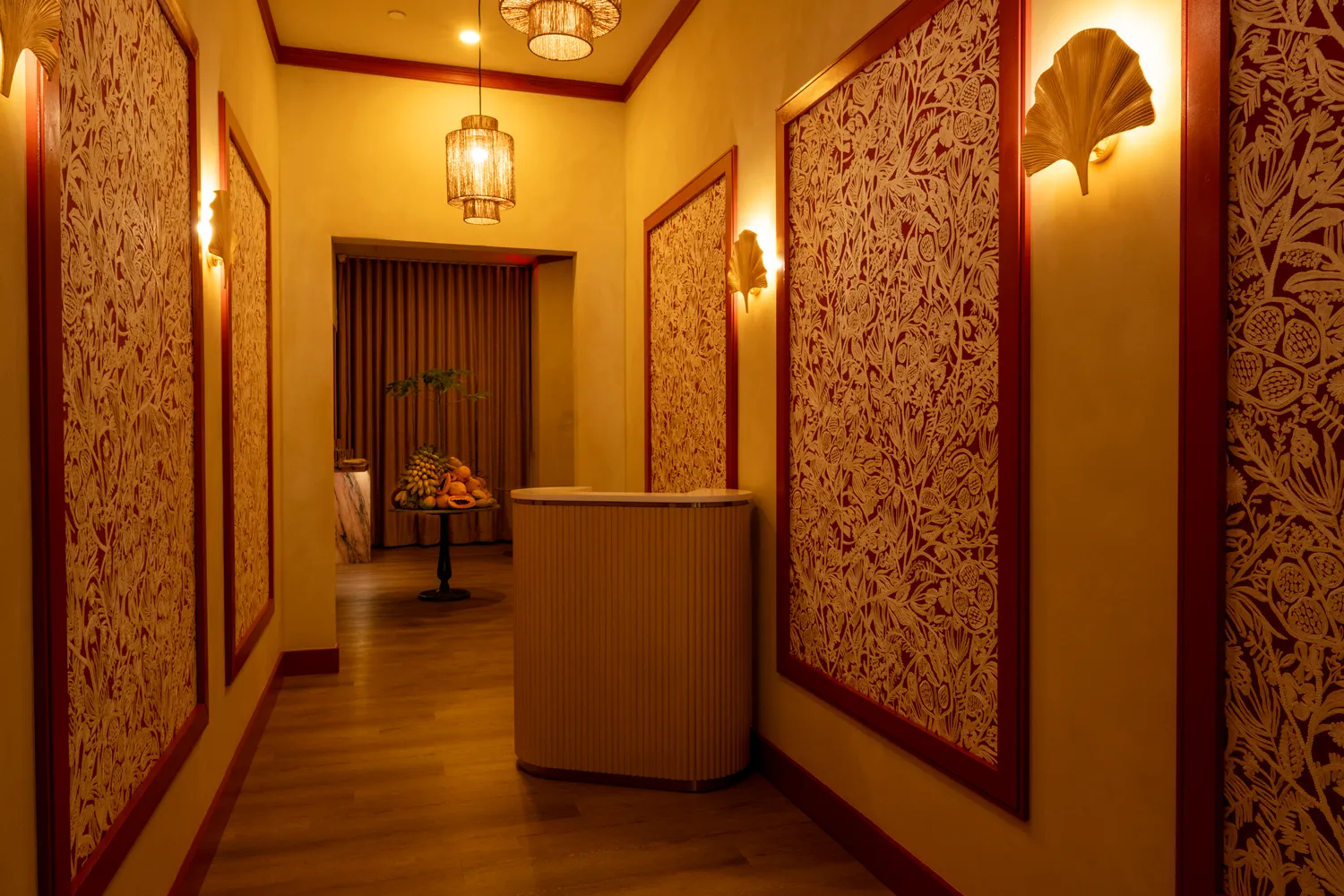 Tropical foyer with sage stone table at Paya restaurant, Miami Beach