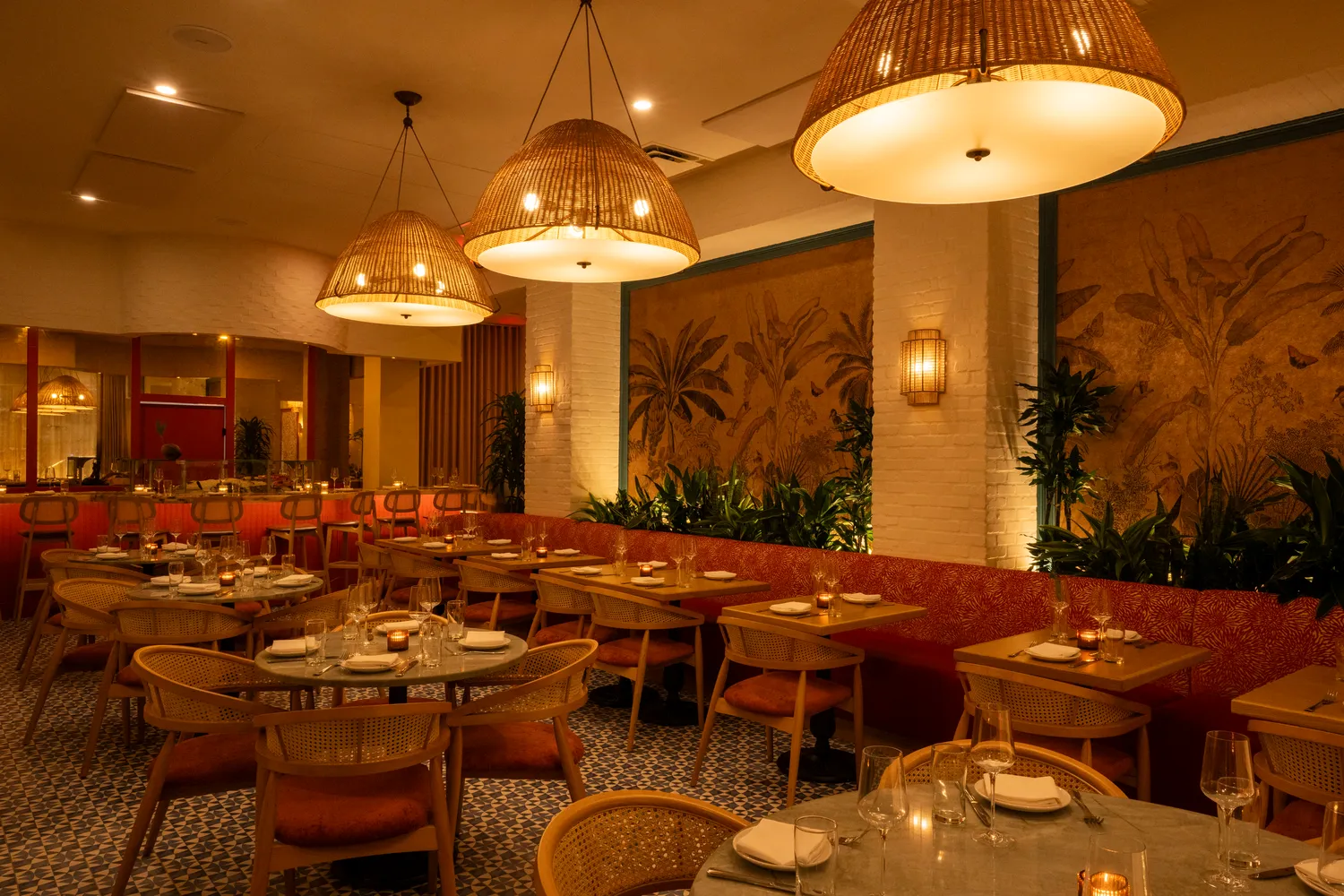 Coral raw bar and plant-lined banquettes at Paya restaurant, Miami Beach